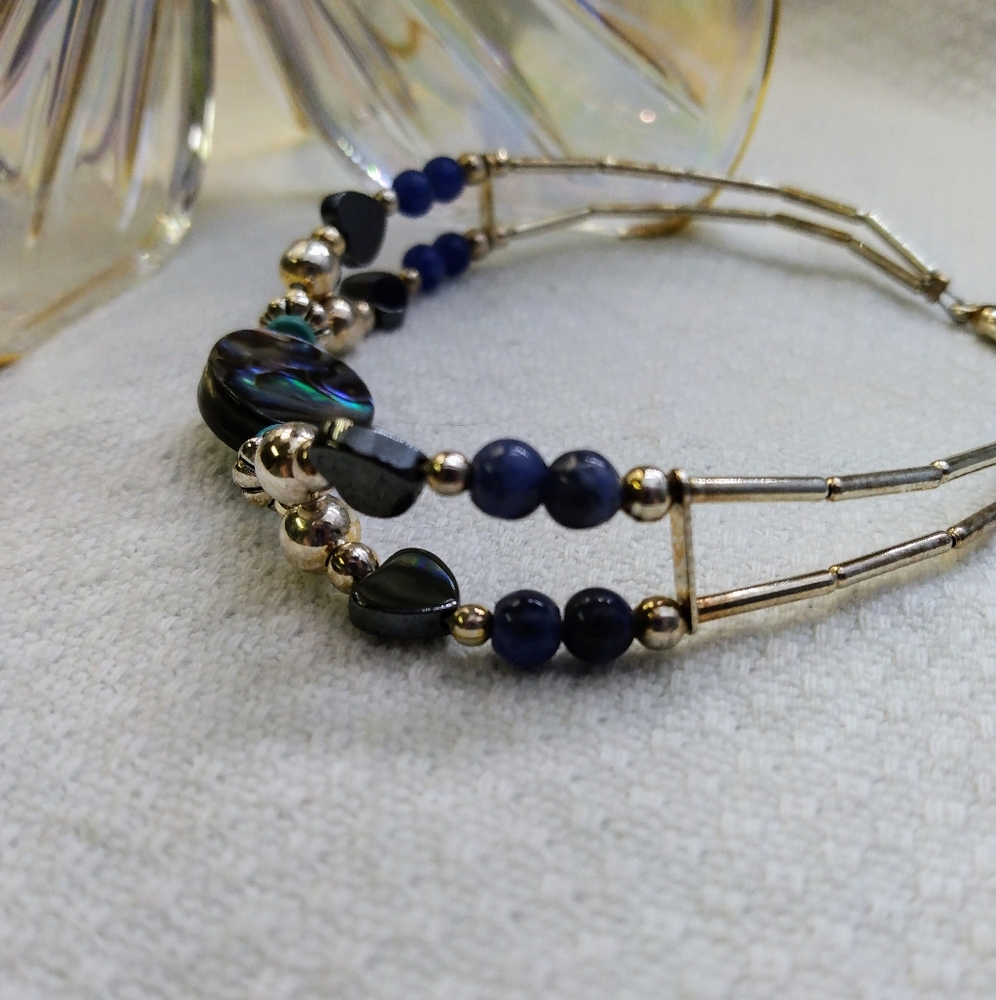 Women's multi stone bracelet with silver tone accents. 8". Good used condition. - Picture 11 of 11